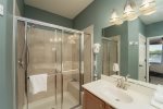 UPPER LEVEL BATHROOM 2 - WALK IN SHOWER WITH TILED BENCH SEATING  IN BEDROOM 1 KING BED MASTER SUITE